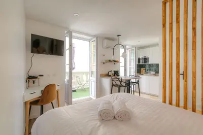 Un ou plusieurs lits dans un hébergement de l'établissement Joli studio climatisé avec terrasse - Lyon centre