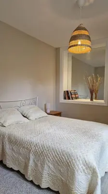 Un ou plusieurs lits dans un hébergement de l'établissement Le Champ du Roy Appartement 76m2 Lyon Sud 5min A7 parking privé