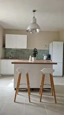 Cuisine ou kitchenette dans l'établissement Le Champ du Roy Appartement 76m2 Lyon Sud 5min A7 parking privé