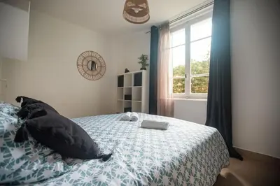 Un ou plusieurs lits dans un hébergement de l'établissement L'onde Douce - T2 Cosy - Proximité tram T3 & T7