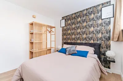 Un ou plusieurs lits dans un hébergement de l'établissement Appartement 
