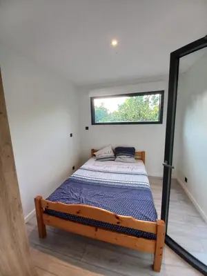 Un ou plusieurs lits dans un hébergement de l'établissement Tiny house dans l'ouest lyonnais