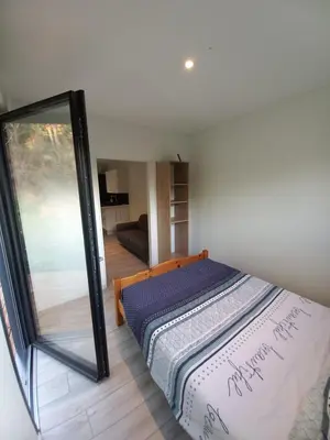 Un ou plusieurs lits dans un hébergement de l'établissement Tiny house dans l'ouest lyonnais