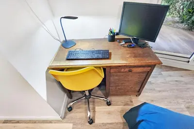 Télévision ou salle de divertissement dans l'établissement Oasis Citadine