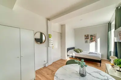 Un ou plusieurs lits dans un hébergement de l'établissement L'Olivier - Cosy studio rénové au coeur de Lyon 5ème