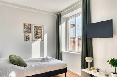 Un ou plusieurs lits dans un hébergement de l'établissement L'Olivier - Cosy studio rénové au coeur de Lyon 5ème
