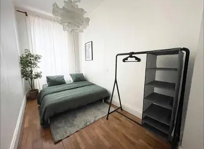 Un ou plusieurs lits dans un hébergement de l'établissement Appartement Brunard