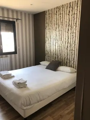 Un ou plusieurs lits dans un hébergement de l'établissement Belle villa proche de Lyon dans le Beaujolais