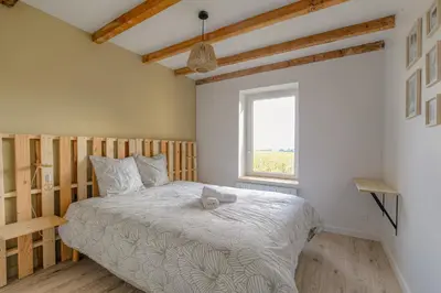 Un ou plusieurs lits dans un hébergement de l'établissement New maison au coeur des vignes