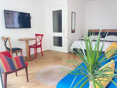 Un ou plusieurs lits dans un hébergement de l'établissement Charmant Studio Tete dor lyon