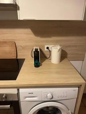 Cuisine ou kitchenette dans l'établissement Le Zola parking - Groupama stadium-LDLC Arena-Eurexpo