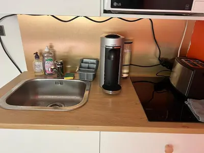Cuisine ou kitchenette dans l'établissement Adorable studio Équipé plein centre proche Foch
