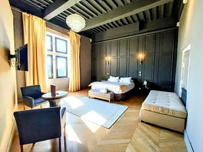 Un ou plusieurs lits dans un hébergement de l'établissement Les Chambres De La Renaissance
