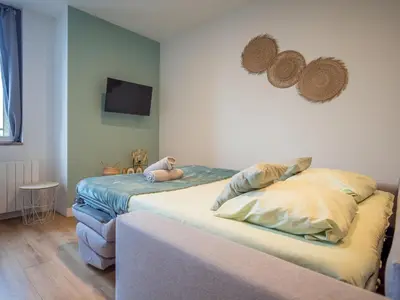Un ou plusieurs lits dans un hébergement de l'établissement Le cosy Twin