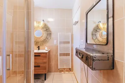 Salle de bains dans l'établissement Le Cocon