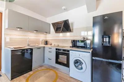 Cuisine ou kitchenette dans l'établissement Le Cocon
