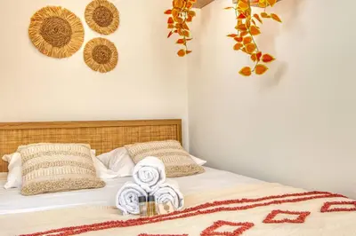 Un ou plusieurs lits dans un hébergement de l'établissement La Suite Soleil - Maison studio avec jardin privé