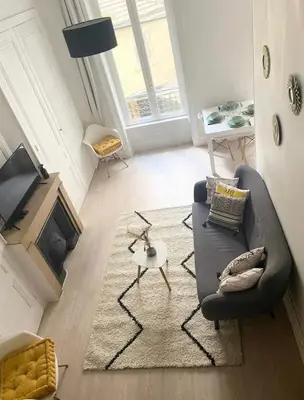 Coin salon dans l'établissement Charmant appartement