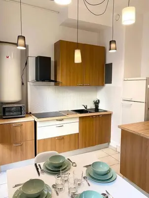 Cuisine ou kitchenette dans l'établissement Charmant appartement