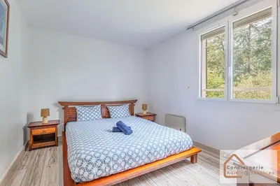 Un ou plusieurs lits dans un hébergement de l'établissement Maison Évasion - Piscine, Jardin & Barbecue