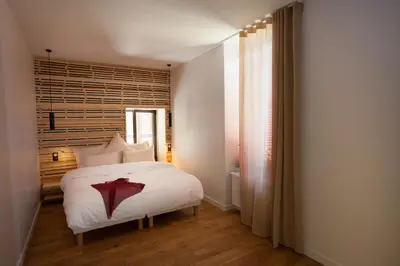 Un ou plusieurs lits dans un hébergement de l'établissement Les chambres de l'Alouette