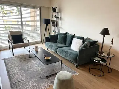 Coin salon dans l'établissement Appartement avec balcon
