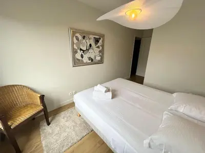 Un ou plusieurs lits dans un hébergement de l'établissement Appartement avec balcon