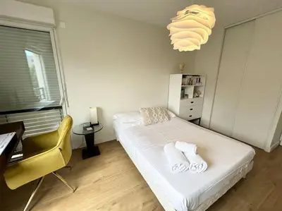 Un ou plusieurs lits dans un hébergement de l'établissement Appartement avec balcon