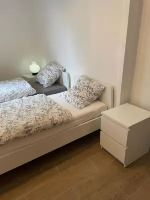 Un ou plusieurs lits dans un hébergement de l'établissement Appartement Charpenne