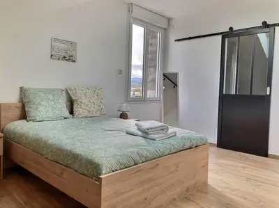 Un ou plusieurs lits dans un hébergement de l'établissement Appartement Zen & Cosy
