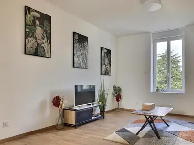 Télévision ou salle de divertissement dans l'établissement Appartement Zen & Cosy