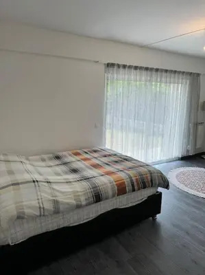 Un ou plusieurs lits dans un hébergement de l'établissement Maison avec Jardin Bron Centre Proche EUREXPO