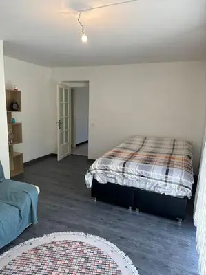 Un ou plusieurs lits dans un hébergement de l'établissement Maison avec Jardin Bron Centre Proche EUREXPO