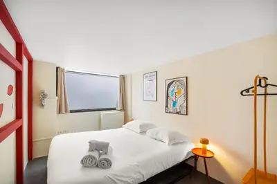 Un ou plusieurs lits dans un hébergement de l'établissement SmartStay Bird Family - X Rousse