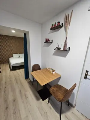 Un ou plusieurs lits dans un hébergement de l'établissement Appartement Type 1 avec parking