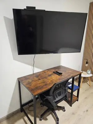 Télévision ou salle de divertissement dans l'établissement Appartement Type 1 avec parking