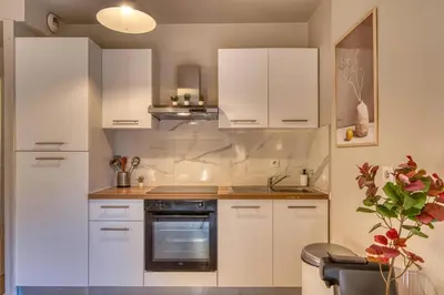 Cuisine ou kitchenette dans l'établissement L'Harmonie - Beau RDJ 2 pers - Tram T5