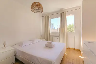 Un ou plusieurs lits dans un hébergement de l'établissement Charmant et Spacieux avec vue à 1 min de Tête d'Or