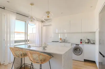 Cuisine ou kitchenette dans l'établissement Charmant et Spacieux avec vue à 1 min de Tête d'Or