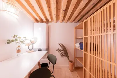 Un ou plusieurs lits dans un hébergement de l'établissement Le Royal - Studio Mezzanine Plein Centre