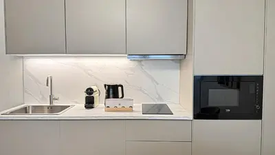 Cuisine ou kitchenette dans l'établissement Suite Paradigme