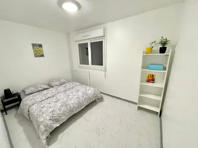 Un ou plusieurs lits dans un hébergement de l'établissement Appartement spacieux et moderne