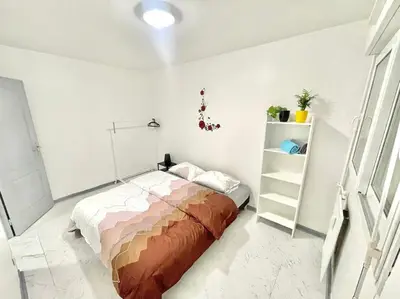 Un ou plusieurs lits dans un hébergement de l'établissement Appartement spacieux et moderne