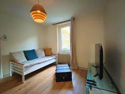 Télévision ou salle de divertissement dans l'établissement Maison vue sur le Rhône à proximité du port