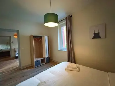 Un ou plusieurs lits dans un hébergement de l'établissement Maison vue sur le Rhône à proximité du port