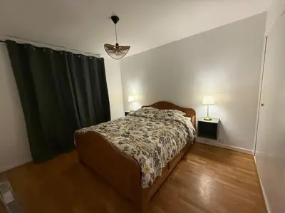 Un ou plusieurs lits dans un hébergement de l'établissement Appartement spacieux