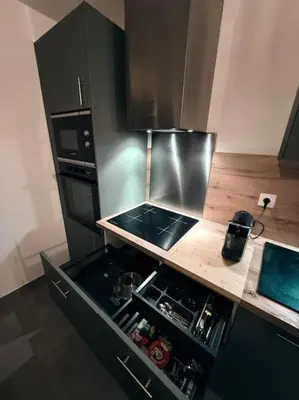 Cuisine ou kitchenette dans l'établissement Appartement spacieux