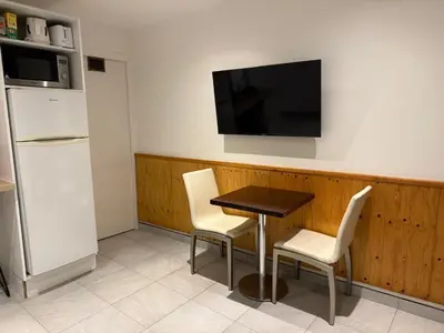Télévision ou salle de divertissement dans l'établissement Logement centre ville Chalamont