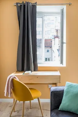 Coin salon dans l'établissement Beige Hospitalité - Agathe - Le nid Urbain