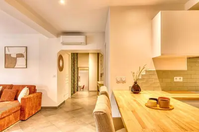 Coin salon dans l'établissement Le Bohème - Climatisé - Superbe T2 centre village